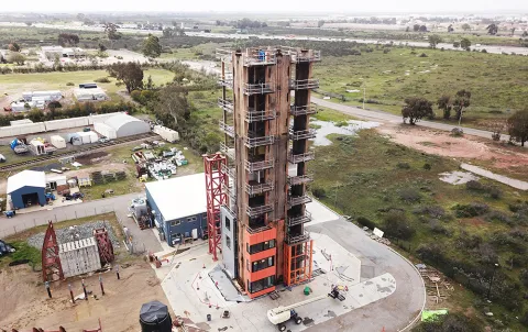 A 10-story building constructed from mass timber and designed to withstand Seattle-area earthquakes is tested at one of the largest shake tables in San Diego. 