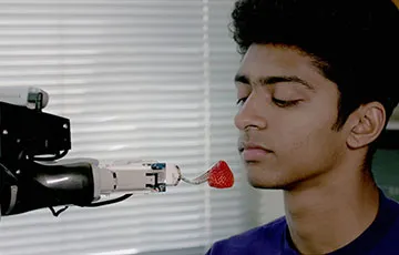 robot feeding a person