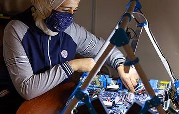 Rania Hussein working with a circuit board