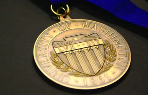 gold colored award medal