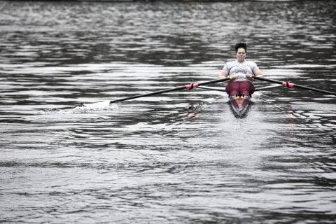 a person rowing in water