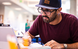 Student working in front of laptop