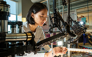 Student working on machine